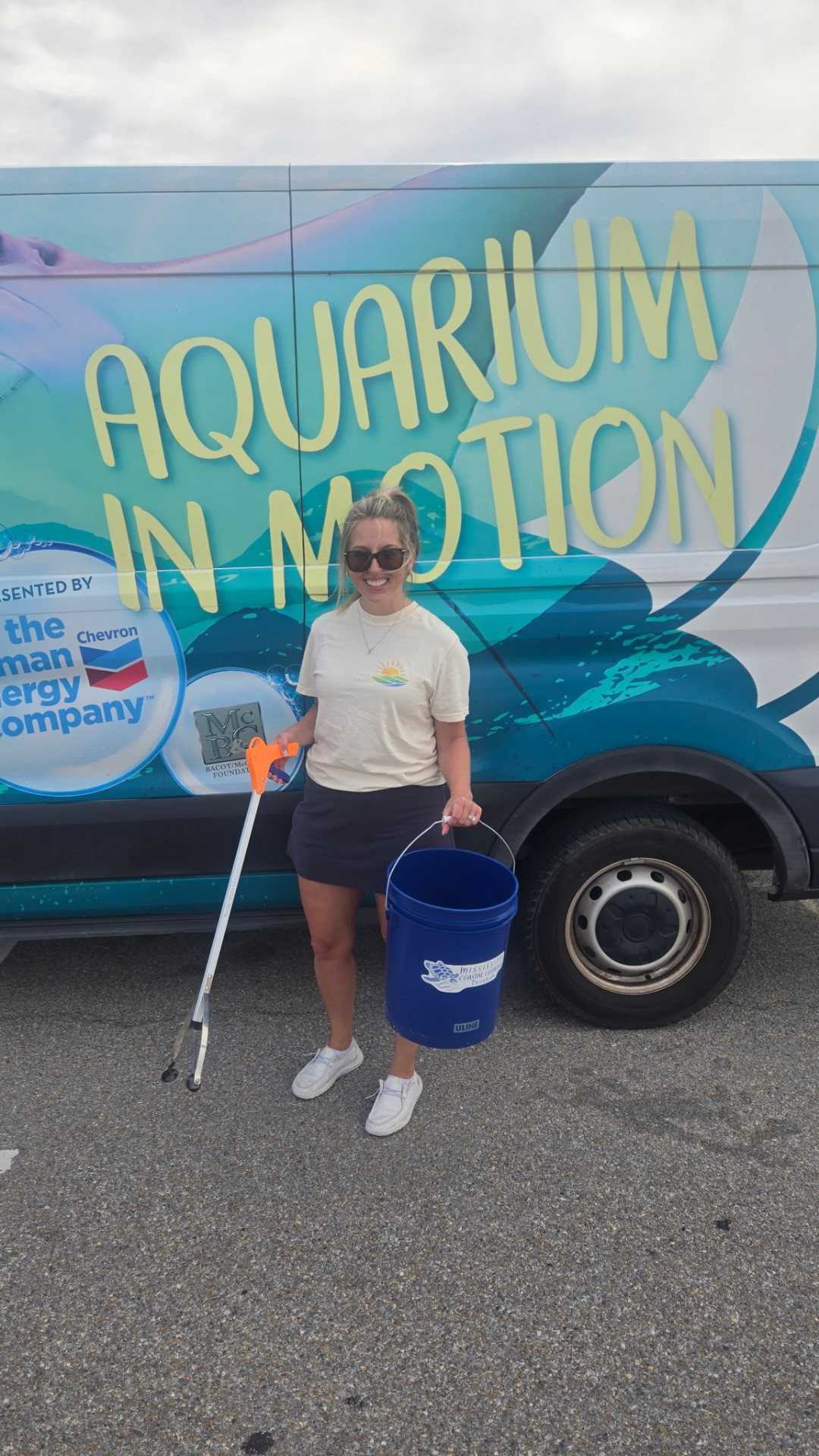 Jenelle volunteering at a Gulf Coast beach cleanup